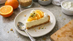 Portakal aromalı cheesecake: kıtır taban, pürüzsüz kıvam (çatlamayı azaltan yöntemle)